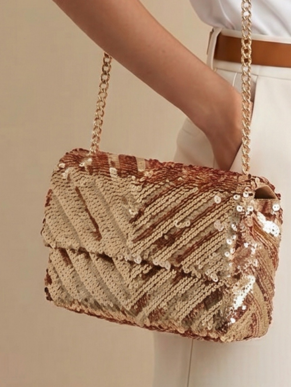 Brand new Nicole Miller, New York gold sequin dress purse with long chain